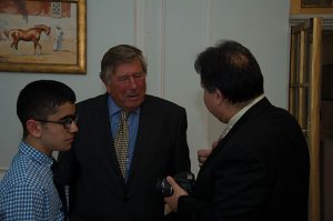 Sir Arthur Denaro CBE DL in conversation with Hamid Mahde and his son Ali
